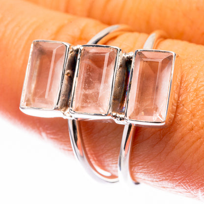 Sterling silver rose quartz ring with three-prong baguette stones