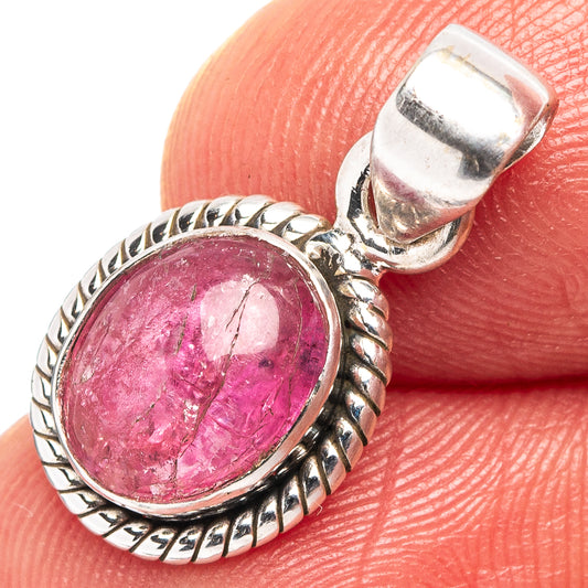 Oval pink tourmaline pendant in .925 sterling silver bezel, close-up.