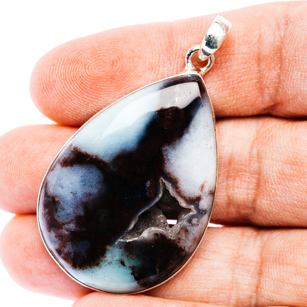 Aquaprase teardrop pendant in .925 sterling silver with blue-black stone