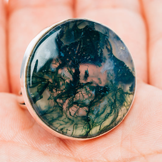 Sterling silver bezel ring featuring round-oval moss agate cabochon, green and teal