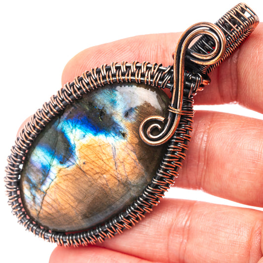 Oxidized copper wire-wrapped labradorite teardrop pendant with loop bail, close-up