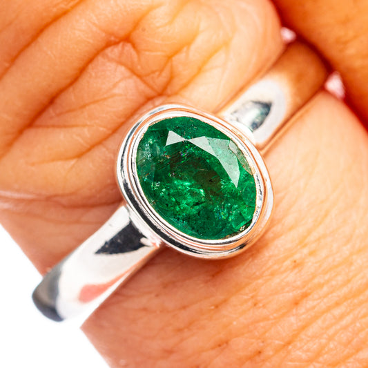 Sterling silver ring with oval green Zambian emerald, close-up setting detail