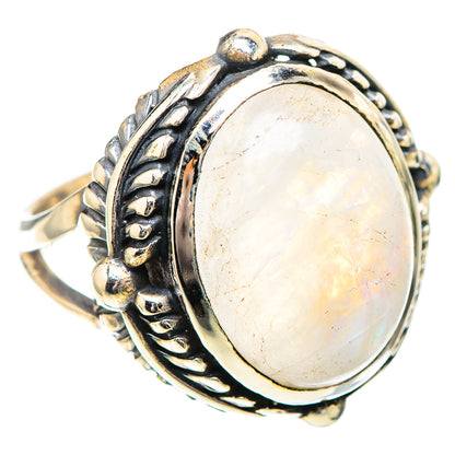Sterling silver oval moonstone ring with detailed swirl band and prong-set center
