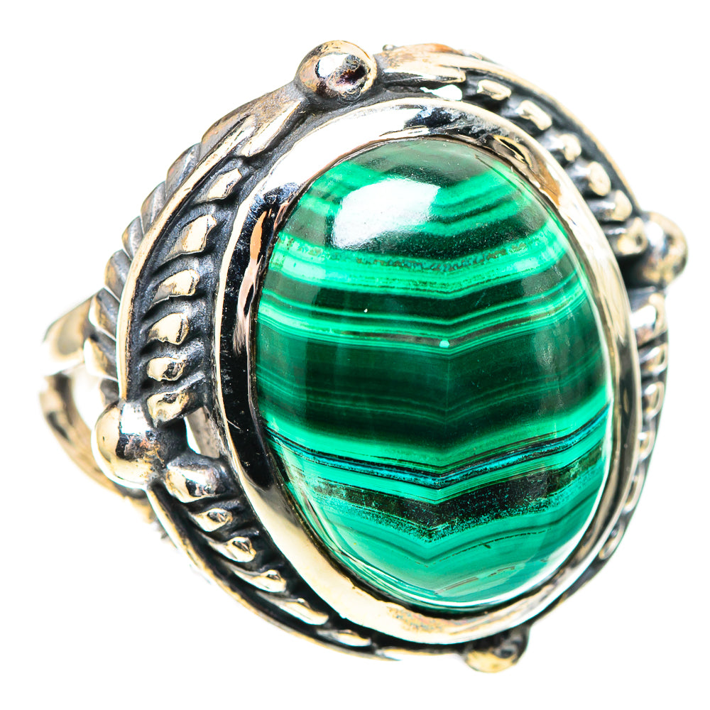 Sterling silver ring with oval green malachite cabochon and detailed metalwork bezel