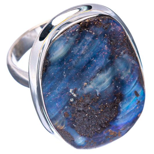 Blue boulder opal oval on a .925 sterling silver ring, angled view of band