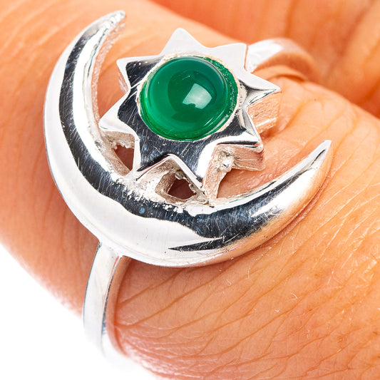 Sterling silver ring with green oval gemstone and moon-sun star details