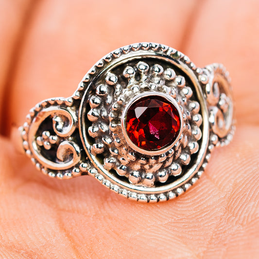 Garnet filigree sterling silver ring with round red gemstone and textured band