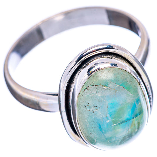 Sterling silver ring with round bezel and oval green opalescent moonstone cabochon