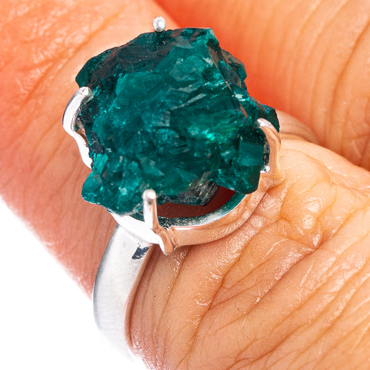 Sterling silver ring with rough green dioptase crystal in prong setting