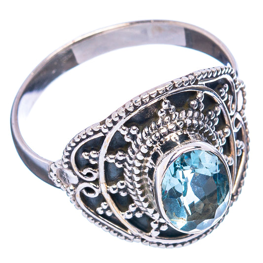 Sterling silver blue topaz ring with ornate filigree and round gemstone, size 8