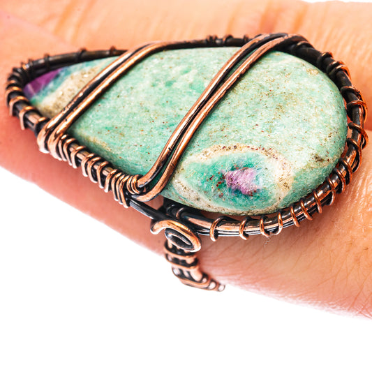 Oxidized copper wire-wrapped ring with oval green fuchsite and purple ruby-like accents