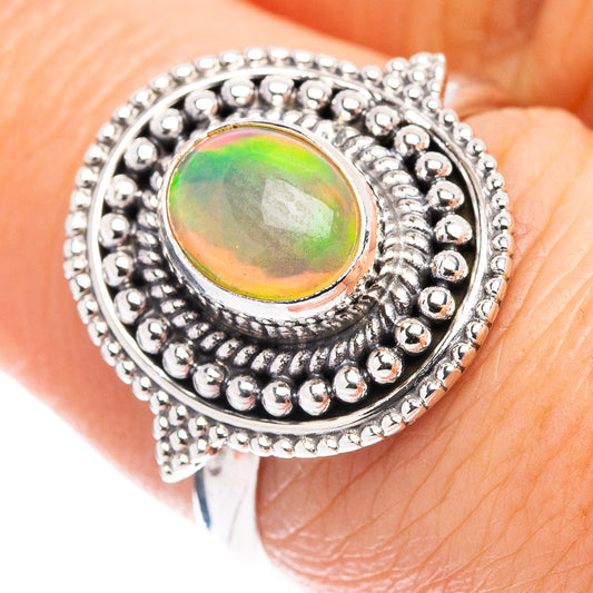 925 sterling silver opal ring with oval Ethiopian opal, beaded halo setting
