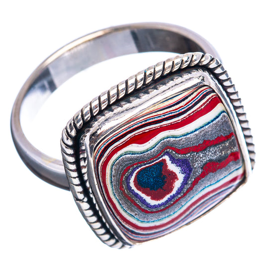 Sterling silver ring with oval fordite in red, blue, purple stripes and inset cabochon