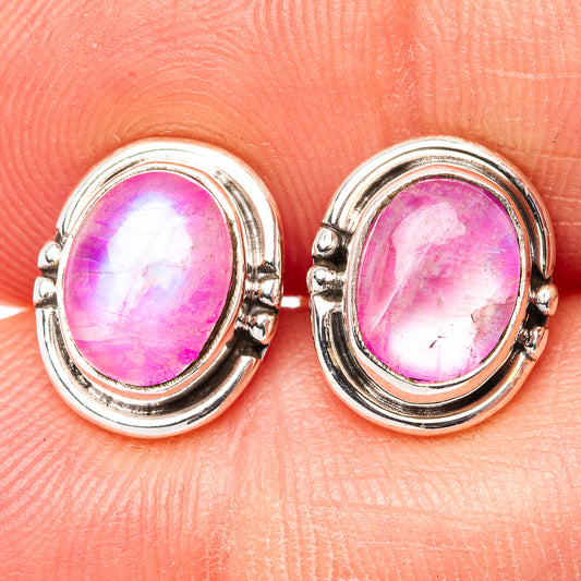 Sterling silver oval gemstone stud earrings with pink cabochon in bezel setting
