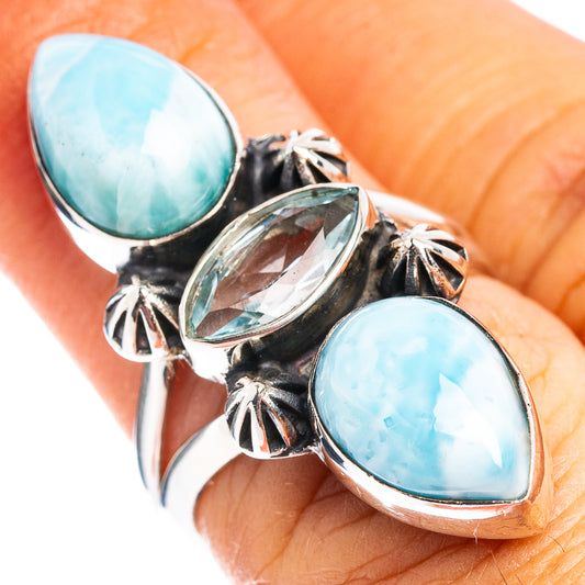 Silver three-stone ring with oval blue larimar-style stones and star cutout accents
