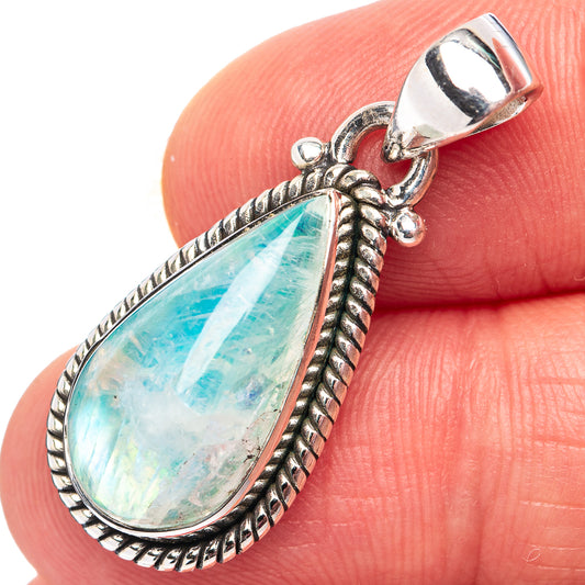 Sterling silver pendant with teardrop green-blue moonstone and textured rope border
