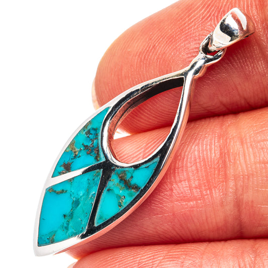 Sterling silver turquoise teardrop pendant with leaf-like inlay detail