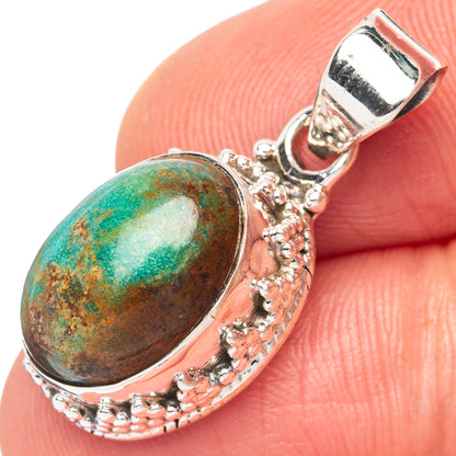 Kingman turquoise oval pendant with ornate sterling silver frame and bail loop