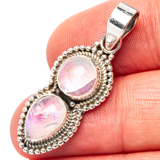 Pink moonstone pendant in .925 sterling silver with two oval bezel-set cabochons