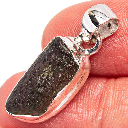 Sterling silver moldavite pendant with dark stone in polished bezel