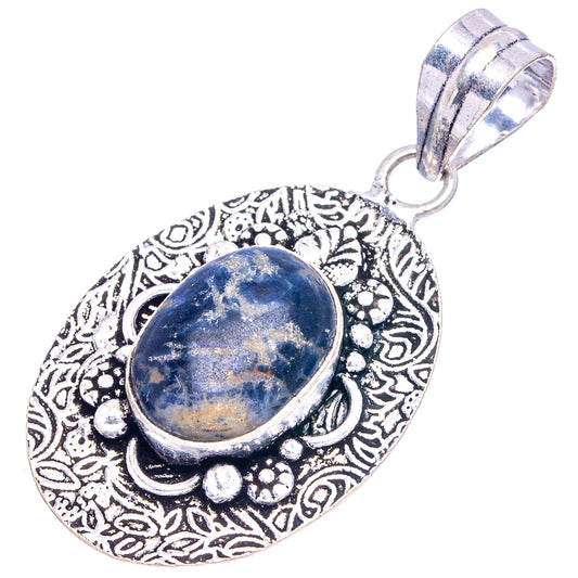 Ornate German silver-tone pendant with oval sodalite cabochon and top bail loop.
