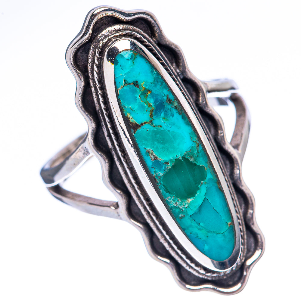 Sterling silver turquoise ring with oval cabochon and textured swirl edge, side view