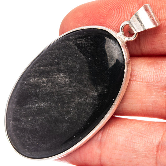 Oval black obsidian pendant with silver-plated bezel and round loop bail