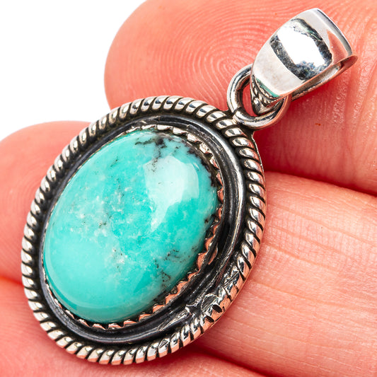 Turquoise oval pendant in ornate .925 sterling silver bezel, with top bail loop