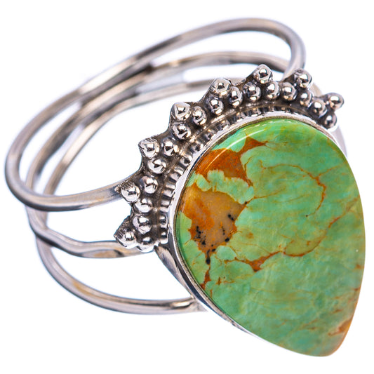 Turquoise cabochon ring in .925 sterling silver, bead-set halo on open band
