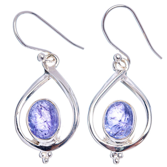 Sterling silver tanzanite teardrop earrings with blue-purple oval stones and hook fasteners.