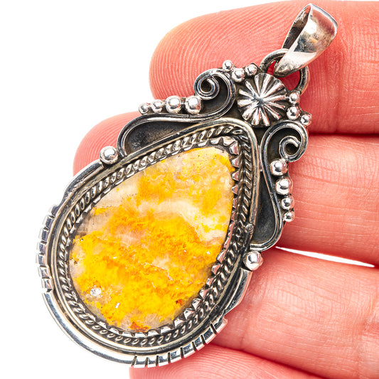 Teardrop yellow jasper pendant in .925 sterling silver with detailed scrollwork