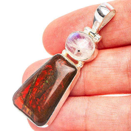 Sterling silver pendant close-up: white round moonstone with red-green iridescent ammolite