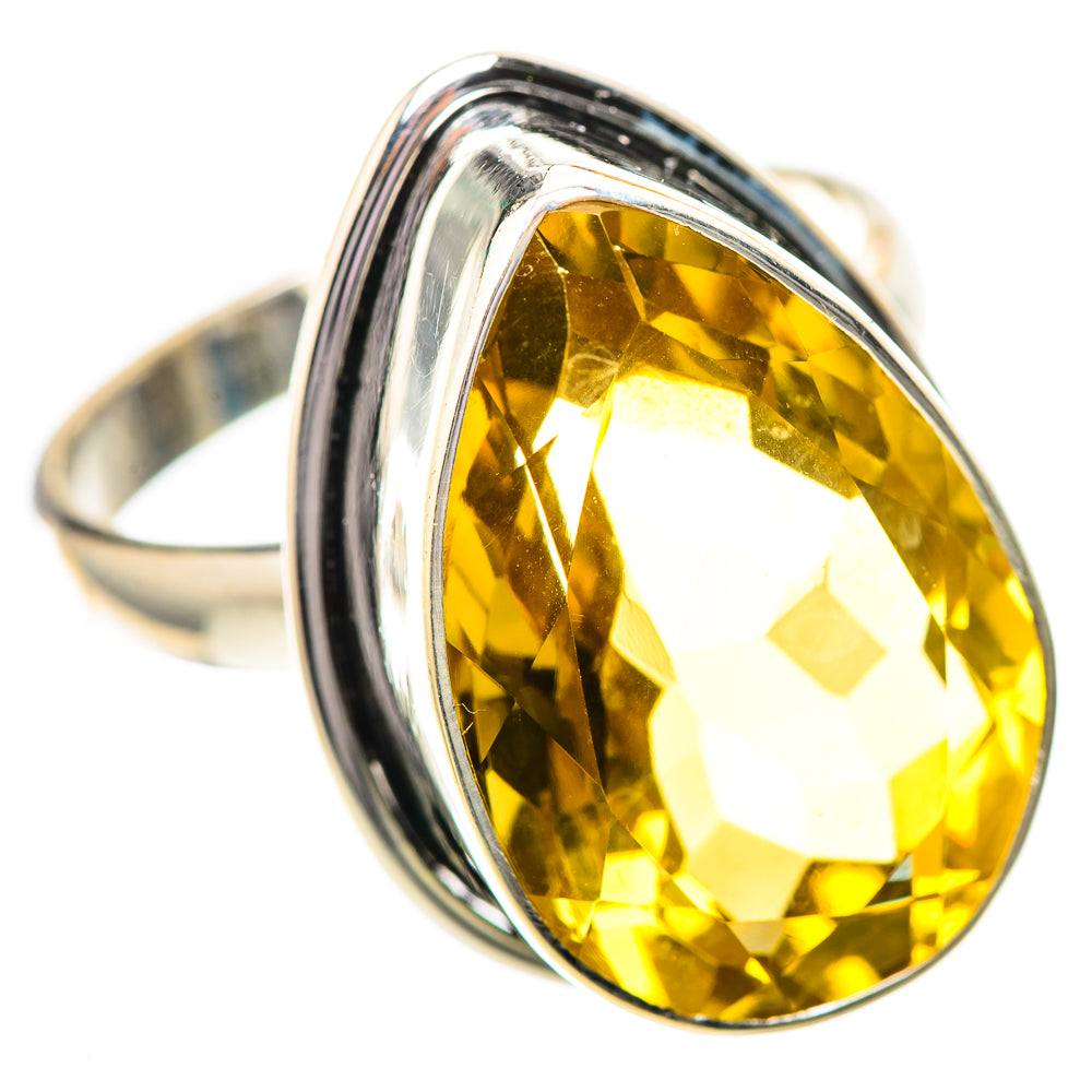 Sterling silver ring featuring a large oval faceted yellow citrine gemstone bezel