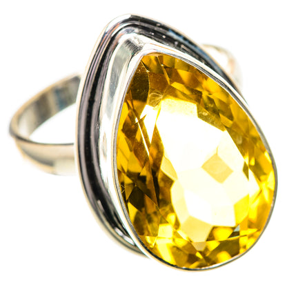 Sterling silver ring featuring a large oval faceted yellow citrine gemstone bezel