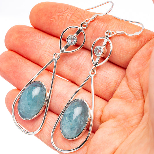 Sterling silver drop earrings with oval aquamarine-blue stones and lever hooks