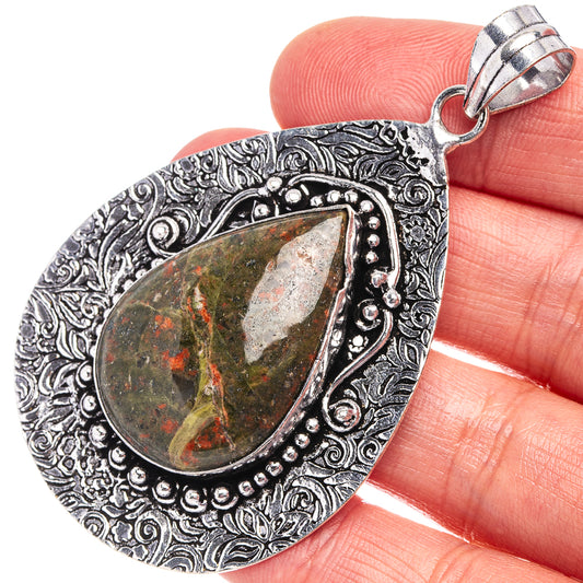 German silver teardrop pendant with unakite cabochon, ornate silver bezel