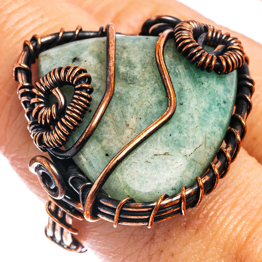 Oxidized copper wire wrap ring with green-blue oval stone, twisted bands