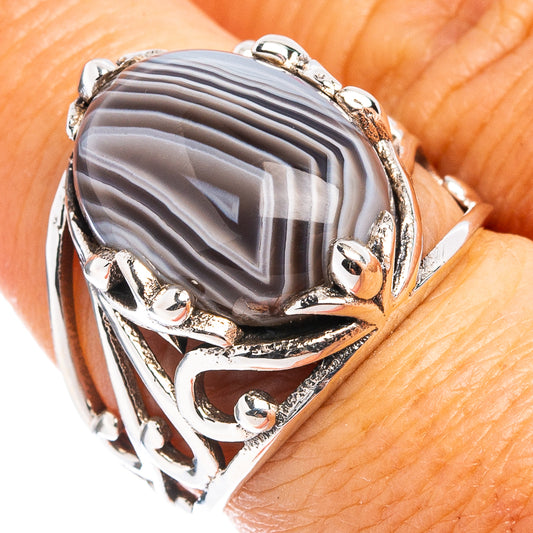 Sterling silver agate ring with oval gray striped gemstone and ornate prong setting