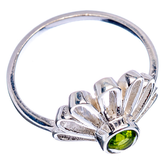 Sterling silver daisy ring with peridot green stone on openwork petal band