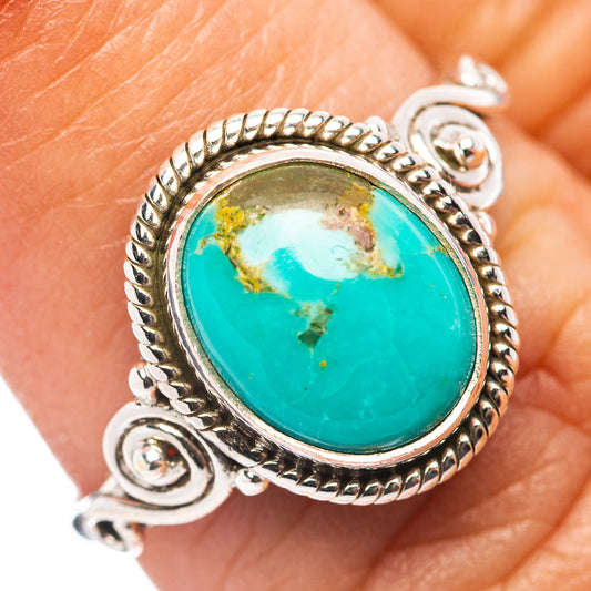 Turquoise cabochon ring in .925 sterling silver with rope bezel and swirl accents