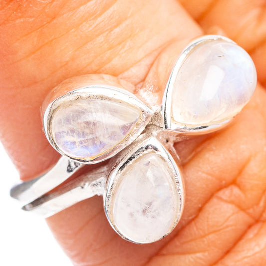 Close-up dainty .925 sterling silver ring with three pale moonstone teardrop cabochons
