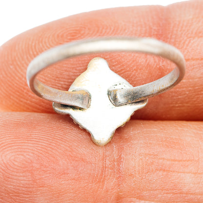 Sterling silver ring with star-shaped top and slim band