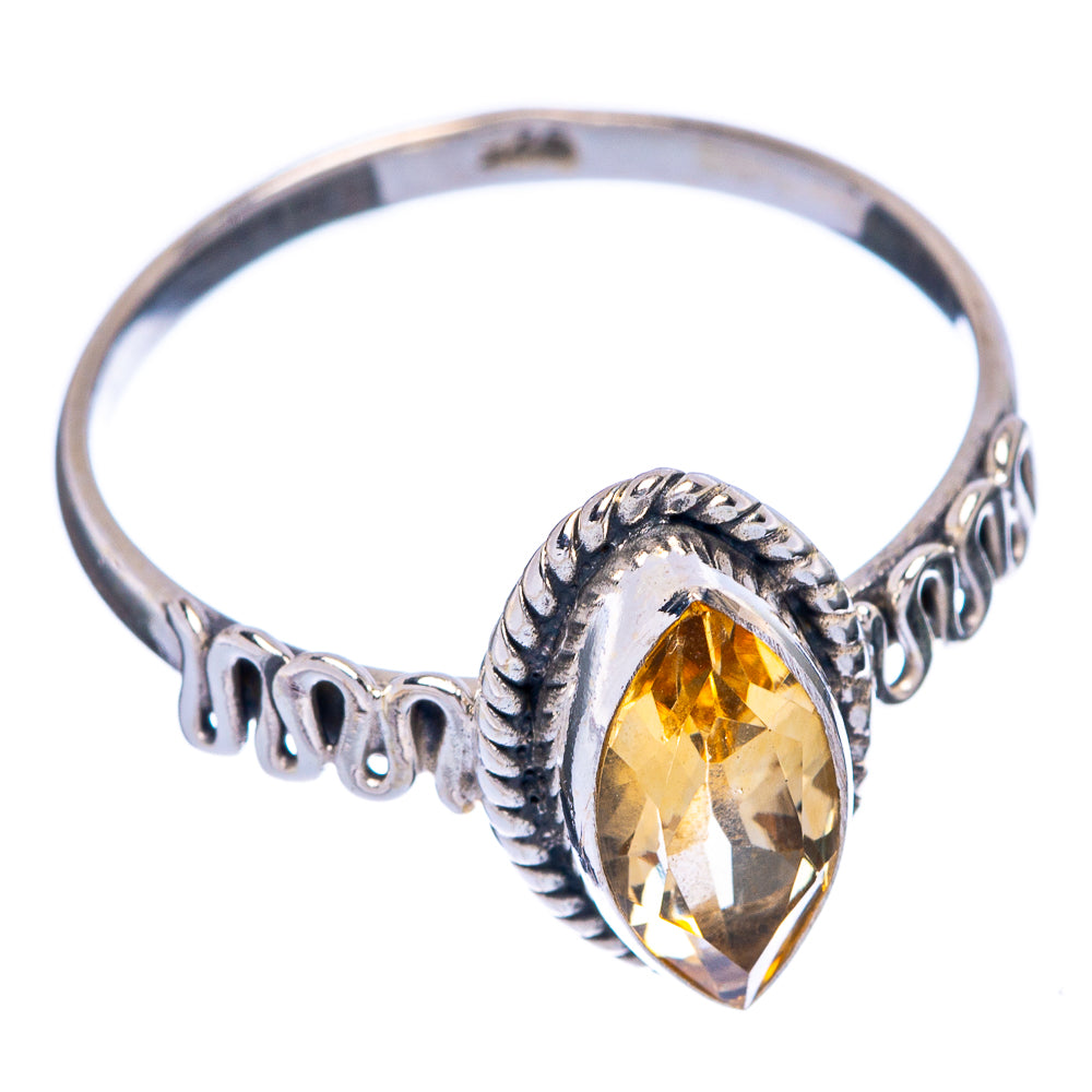 Sterling silver ring with oval faceted citrine centerpiece and ornate halo setting