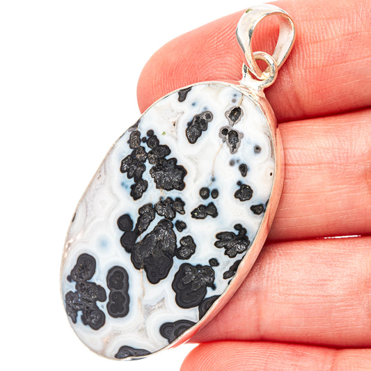 Teardrop agate pendant in white with black speckles and 925 silver bail