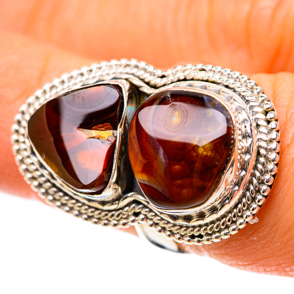 Silver double-stone ring with two teardrop amber fire agate settings and rope borders