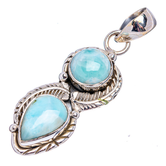Sterling silver larimar pendant, angled view, two oval light-blue stones with decorative frame