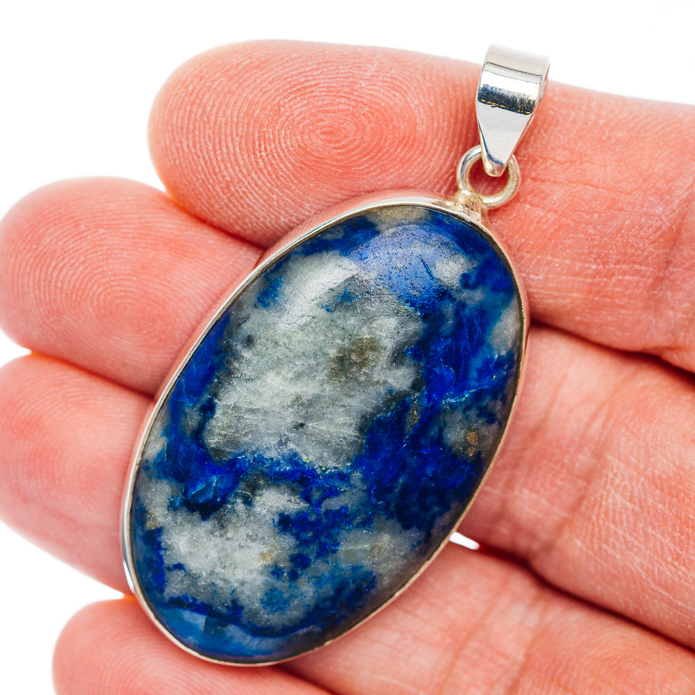 Oval blue Afghanite stone pendant in .925 sterling silver bezel