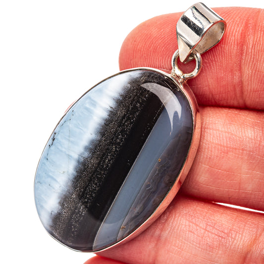 Oval Owyhee opal pendant in .925 sterling silver with bail, banded blue, black, and tan.