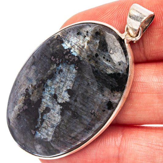 Oval silver-plated pendant with blue-gray larvikite stone and silver bail