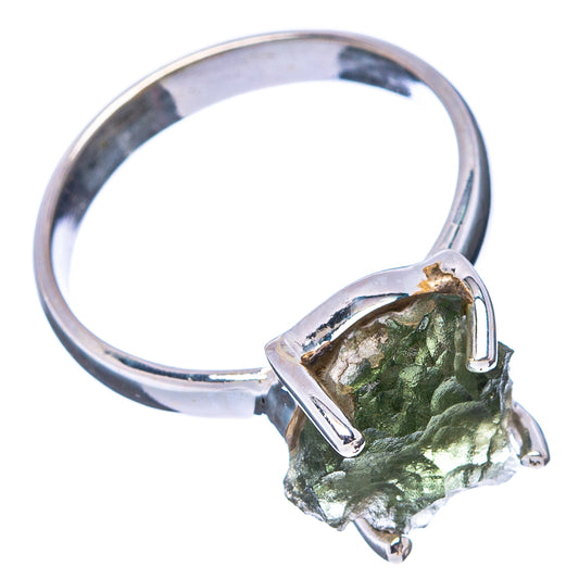 Sterling silver moldavite ring with textured green stone in open prong setting